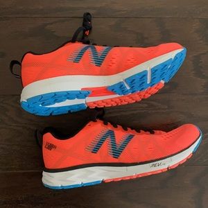 ORANGE Never worn, women’s size 7 New Balance sneakers